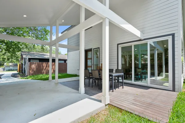 a view of a house with porch and wooden floor