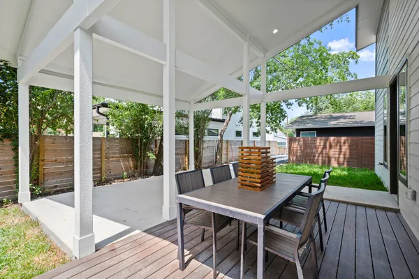 a view of a patio with a table chairs and a table