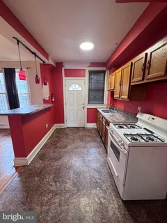 a kitchen with stainless steel appliances granite countertop a stove and a refrigerator