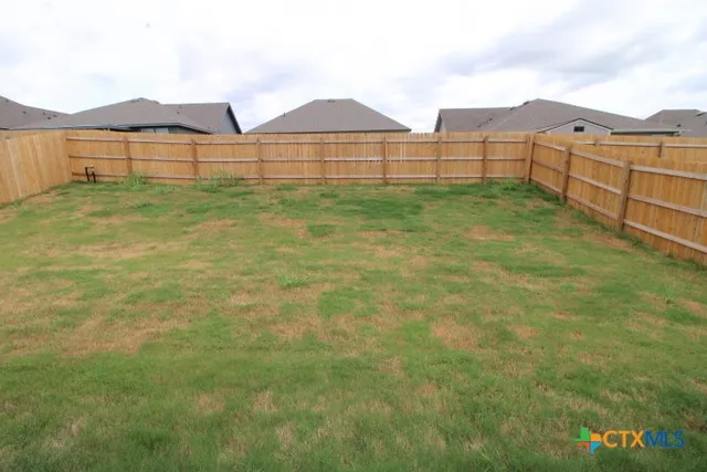 a view of a backyard of a house
