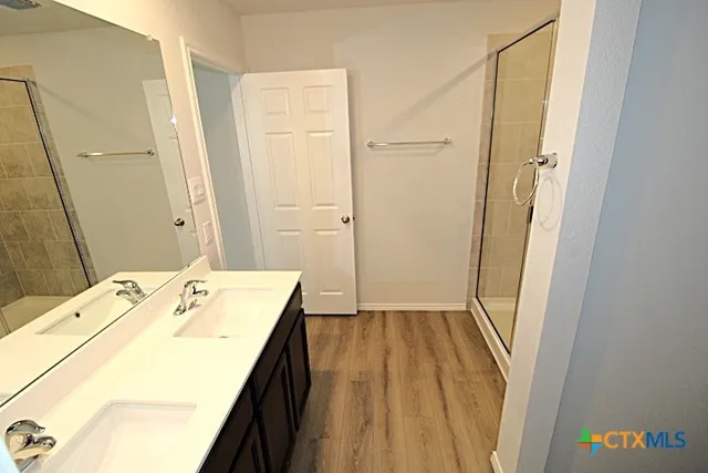 a bathroom with a sink and a mirror