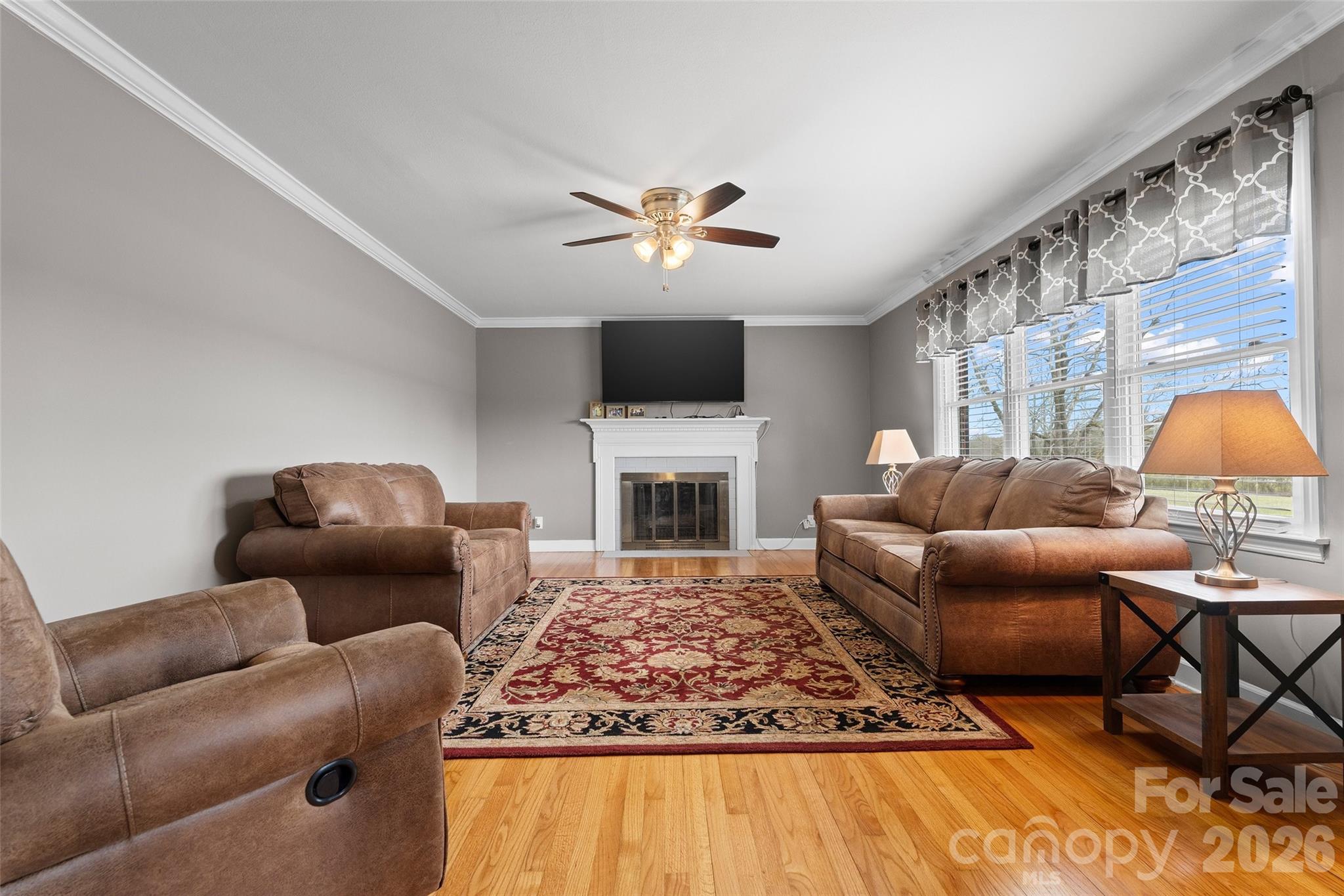 871 Saluda Road Chester, SC 29706 - Photo 4 of 46 a living room with furniture a fireplace and a flat screen tv