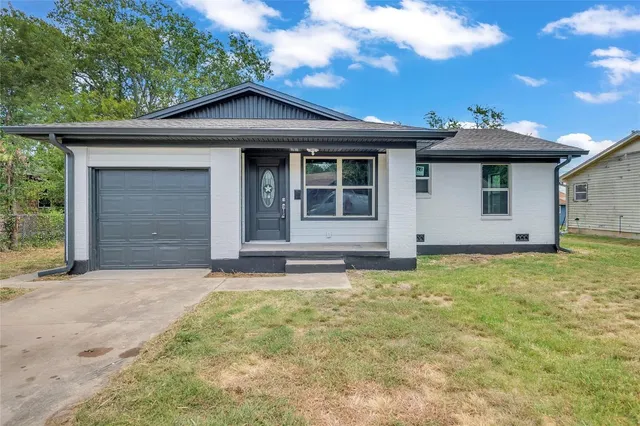 a house with yard in front of it