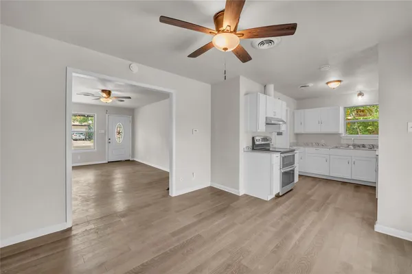 a view of a kitchen with a sink and a window