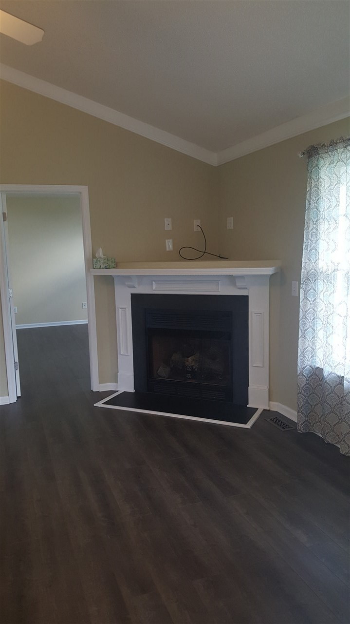 668 Slate Top House Road Clayton, NC 27520 - Photo 15 of 27 Living Room boasts Cathedral Ceilings as well as newly installed floors and Fireplace. This home has it all. Living Room