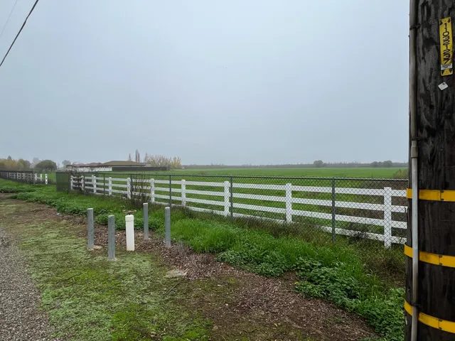 a view of a wooden fence and a bench