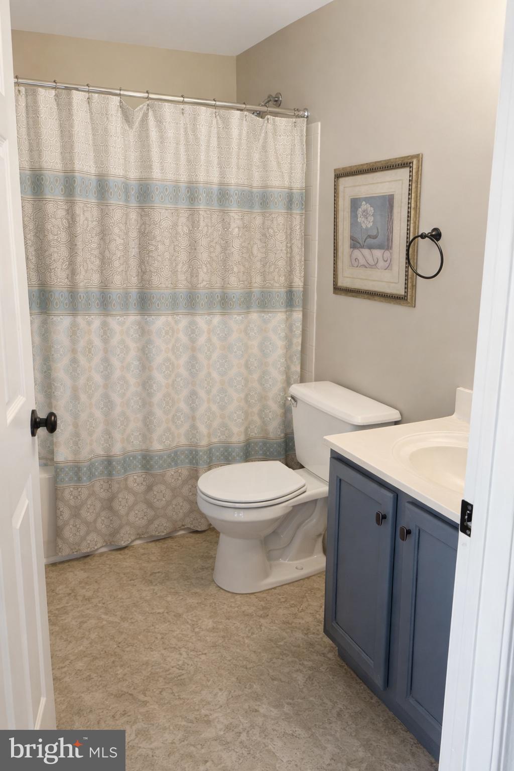 8476 Tackhouse Loop Gainesville, VA 20155 - Photo 11 of 16 a bathroom with a toilet a sink and a shower