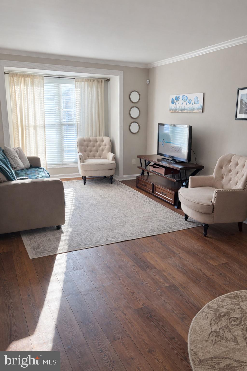 8476 Tackhouse Loop Gainesville, VA 20155 - Photo 5 of 16 a living room with furniture and a flat screen tv