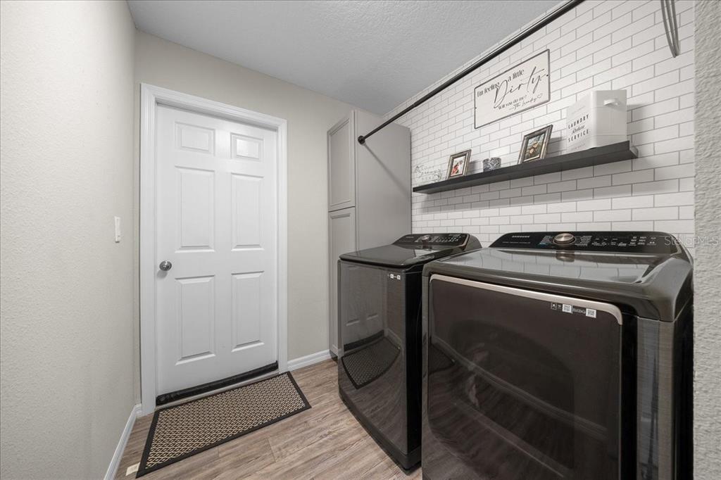 13 Teak Loop Place Ocala, FL 34472 - Photo 24 of 36 a utility room with washer and dryer