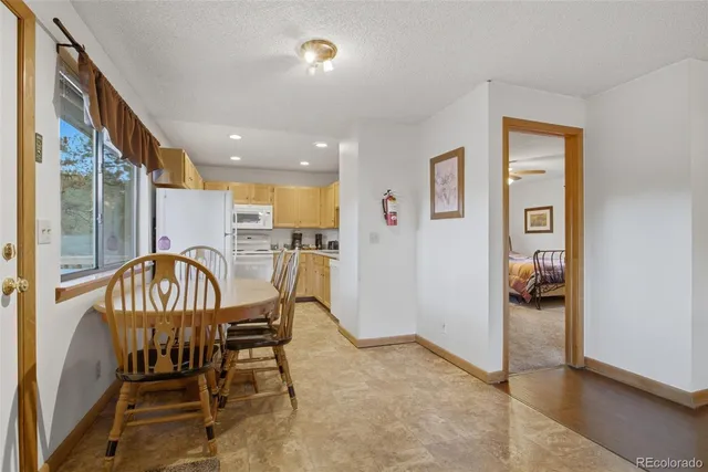 a dining room with furniture and entryway