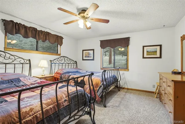 a bedroom with furniture window and wooden floor