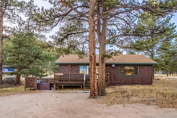 a wooden bench sitting in front of a house