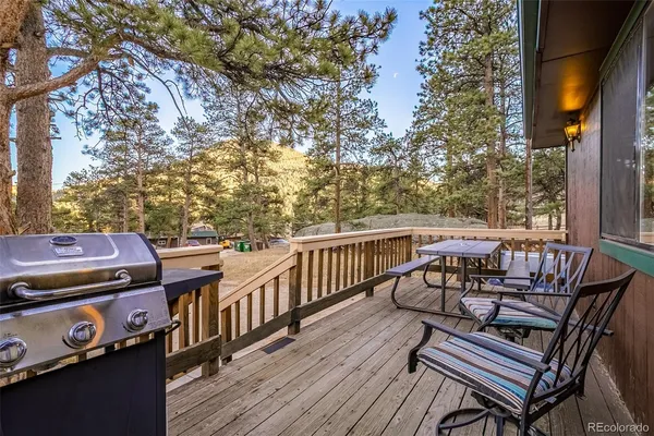 a view of a chairs and table on the deck