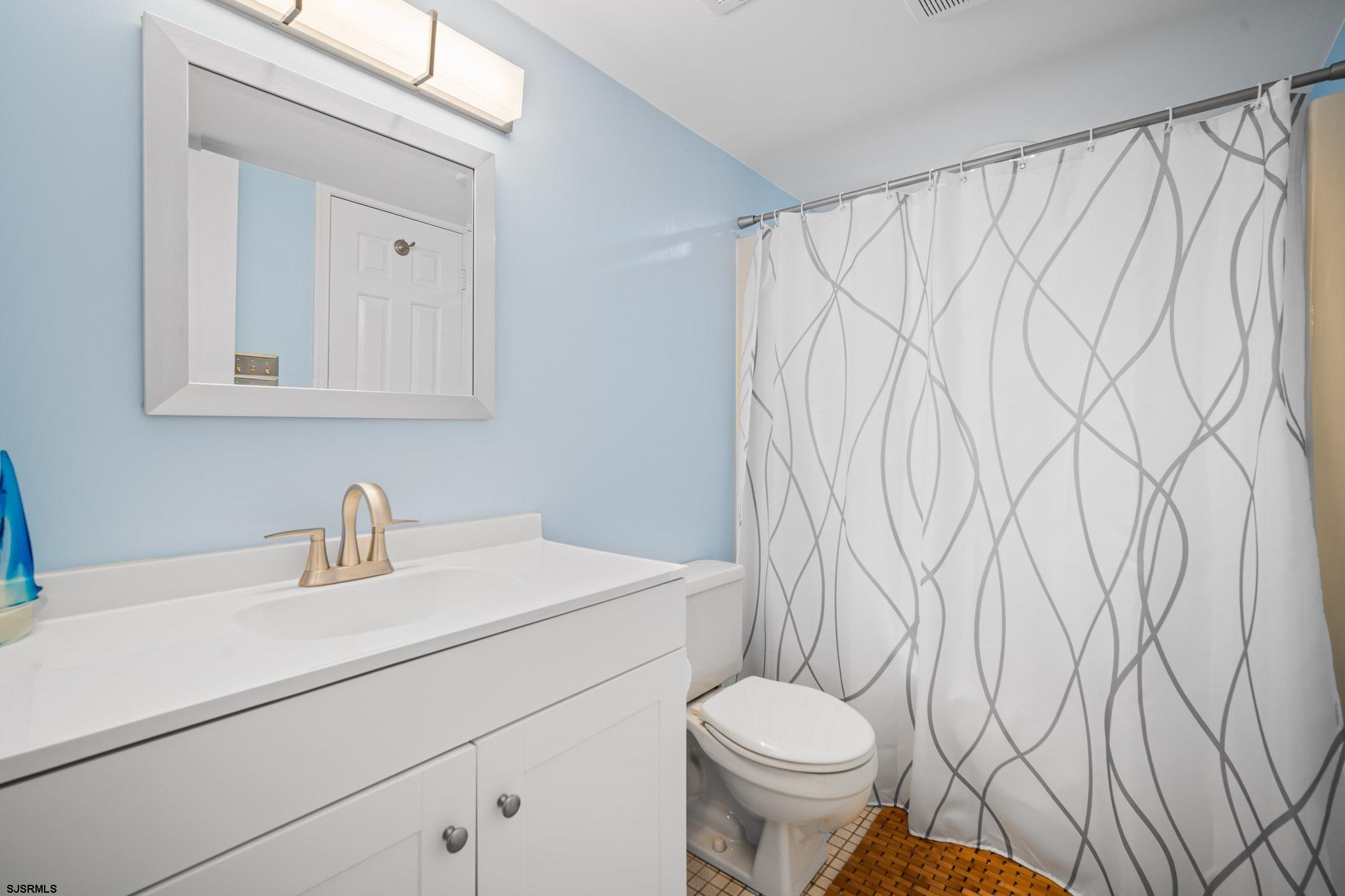 323 44th Street South, Unit 23 Brigantine, NJ 08203 - Photo 11 of 33 a bathroom with a sink and a toilet