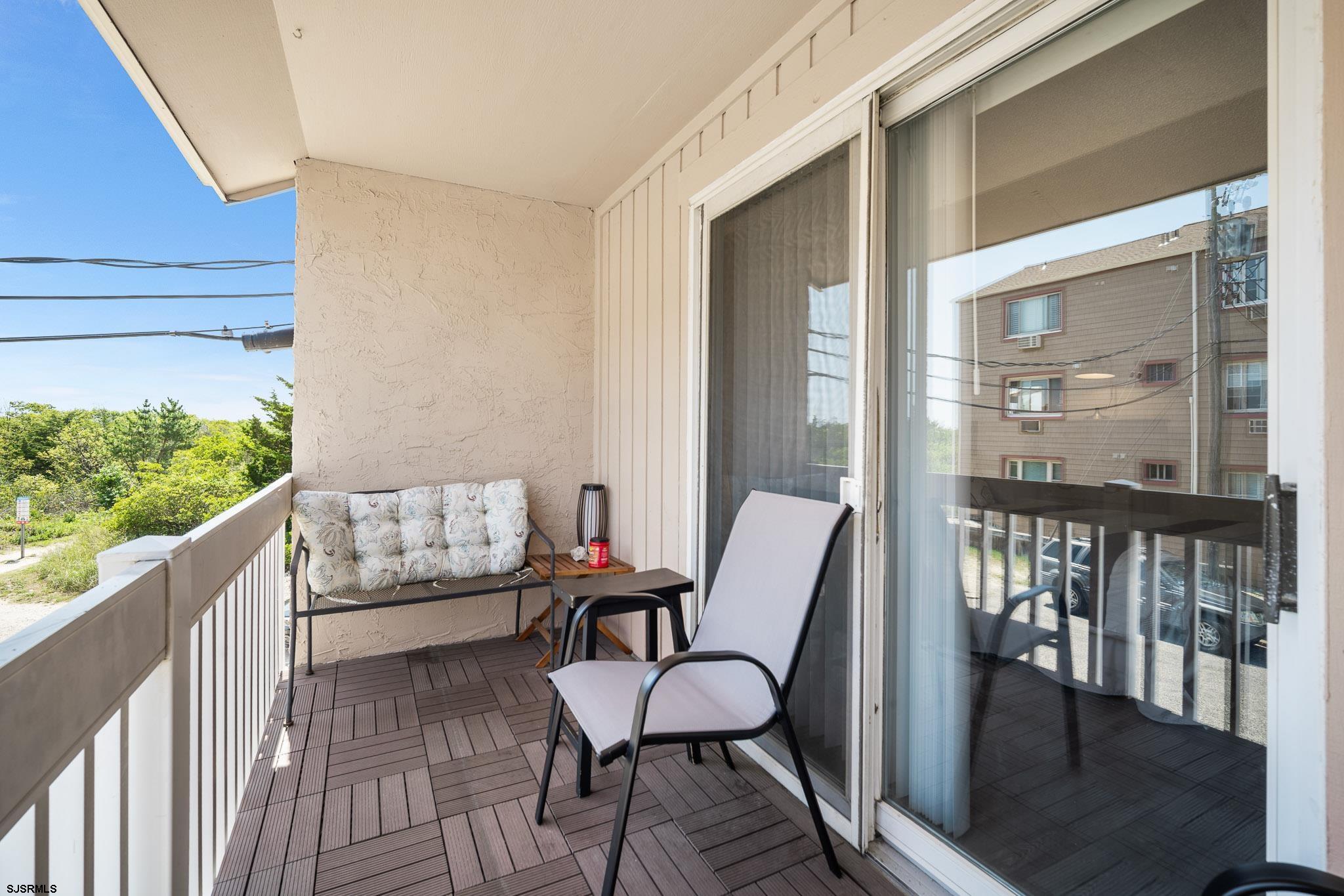 323 44th Street South, Unit 23 Brigantine, NJ 08203 - Photo 13 of 33 a view of a balcony with furniture