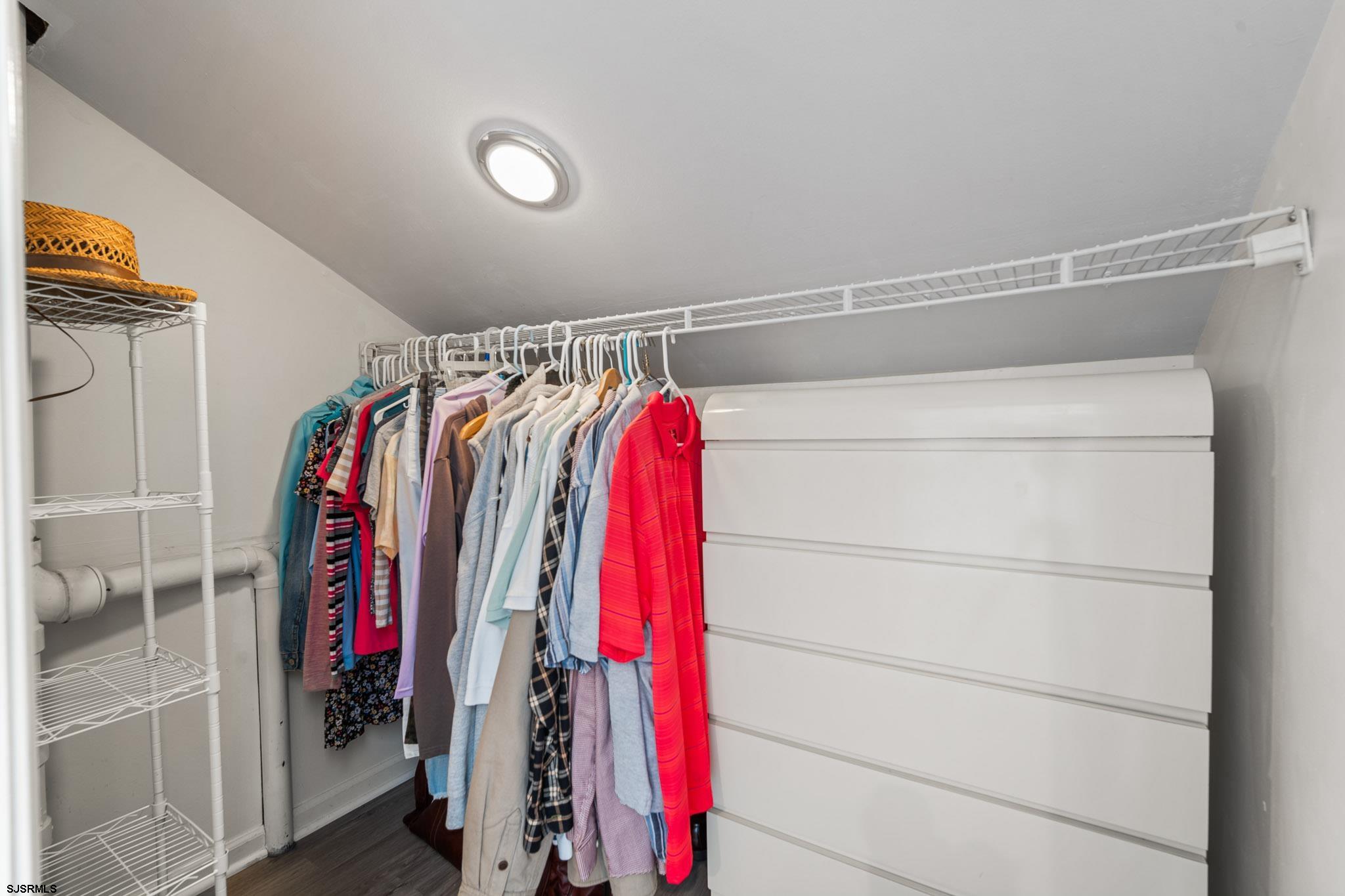 323 44th Street South, Unit 23 Brigantine, NJ 08203 - Photo 16 of 33 a view of walk in closet with clothes