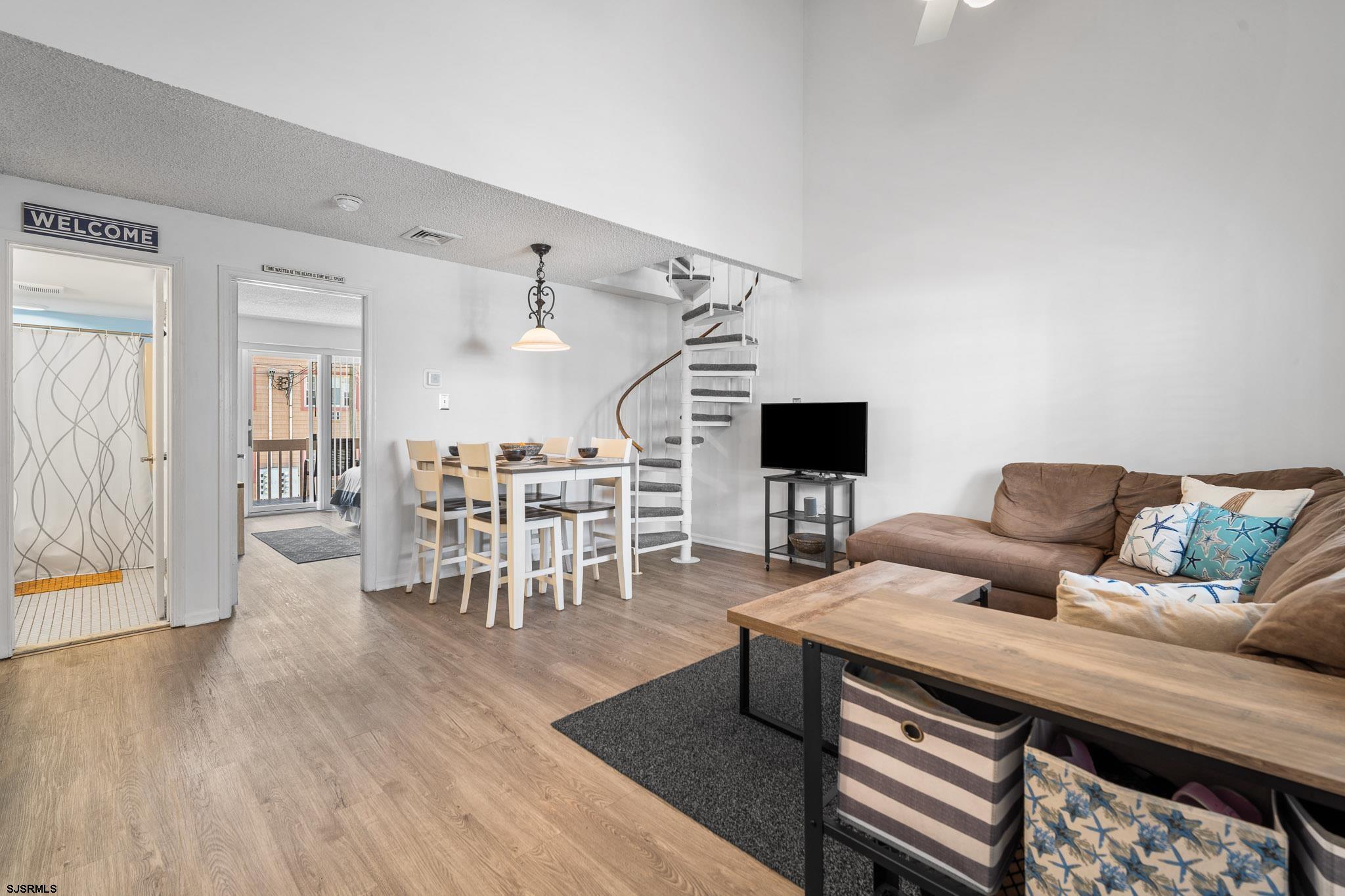 323 44th Street South, Unit 23 Brigantine, NJ 08203 - Photo 2 of 33 a living room with furniture and a wooden floor
