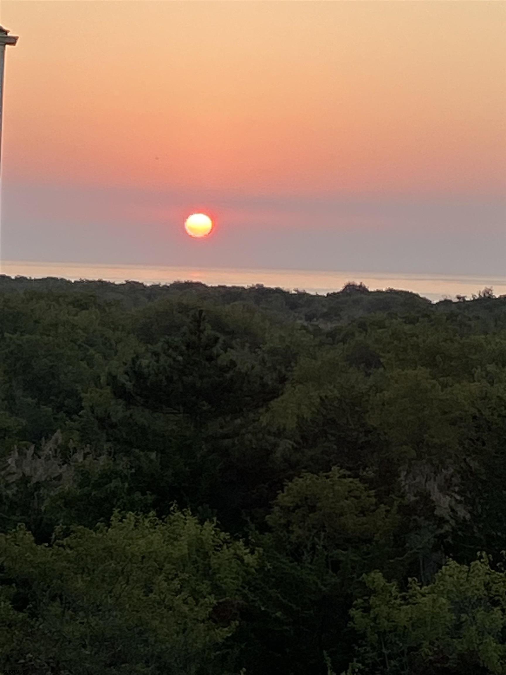 323 44th Street South, Unit 23 Brigantine, NJ 08203 - Photo 33 of 33 a view of sunset and yard