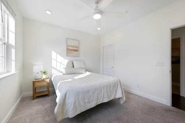 a bathroom with a sink mirror and vanity