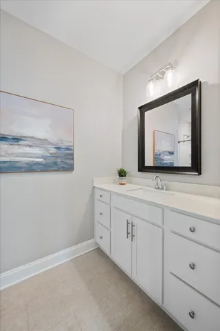 a bathroom with a toilet a sink and shower