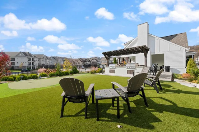 a view of a big yard with table and chairs