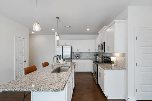 a kitchen with counter space cabinets and appliances