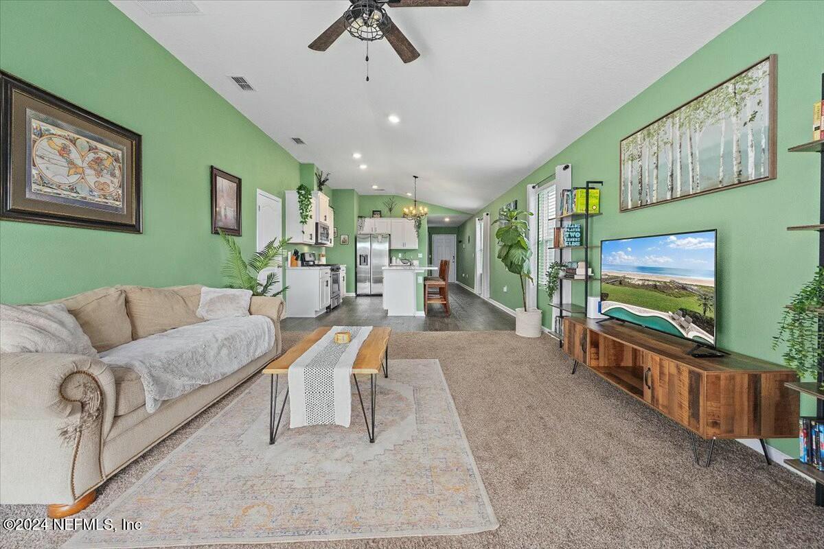 231 Caminha Circle St. Augustine, FL 32084 - Photo 5 of 15 a living room with furniture and a flat screen tv