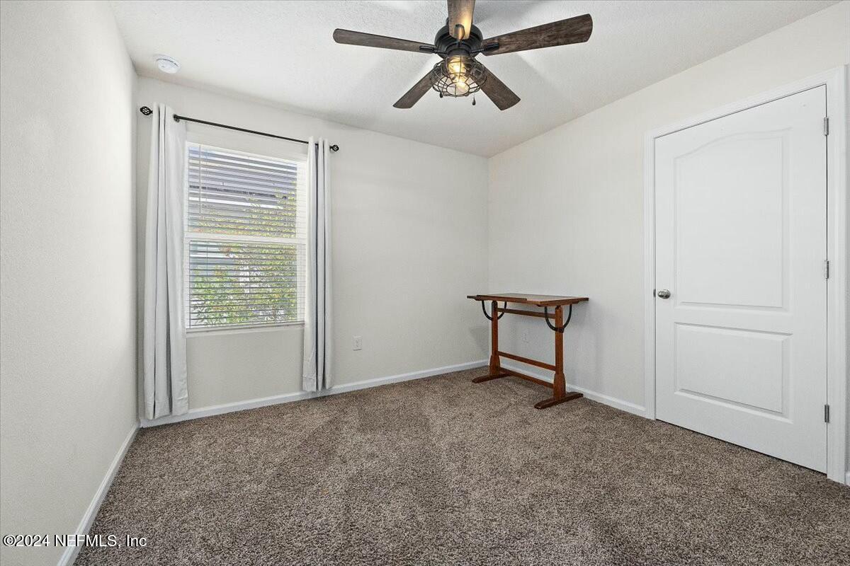 231 Caminha Circle St. Augustine, FL 32084 - Photo 10 of 15 a view of an empty room with a window