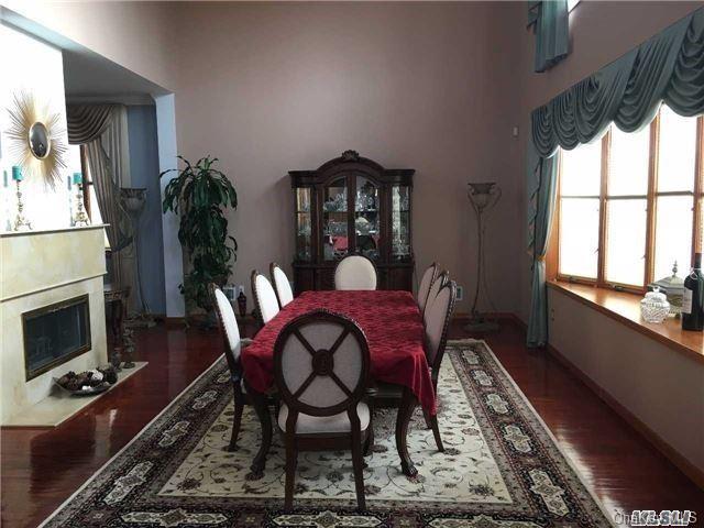 86-47 Clio Street Queens, NY 11423 - Photo 2 of 4 a view of a dining room with furniture window and wooden floor