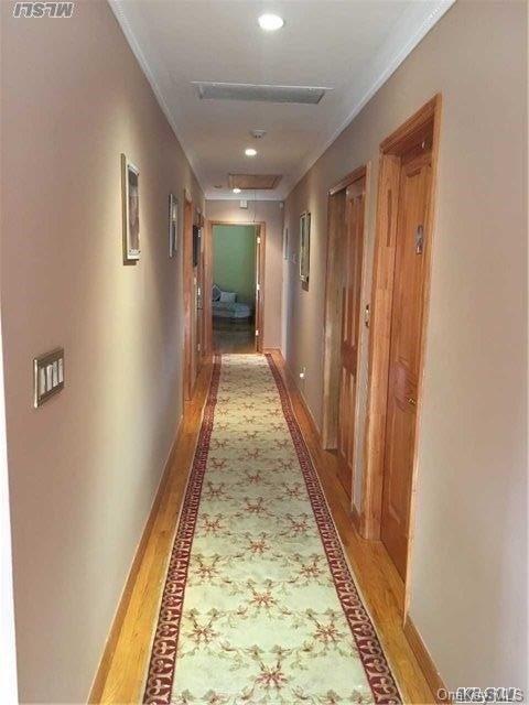 86-47 Clio Street Queens, NY 11423 - Photo 3 of 4 a view of gallery with wooden floor