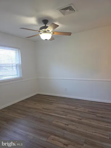 a kitchen with cabinets appliances a sink and a counter top