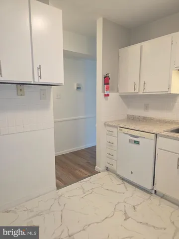 a white refrigerator freezer sitting in a kitchen