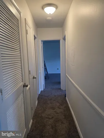 a bathroom with a toilet and a bathtub