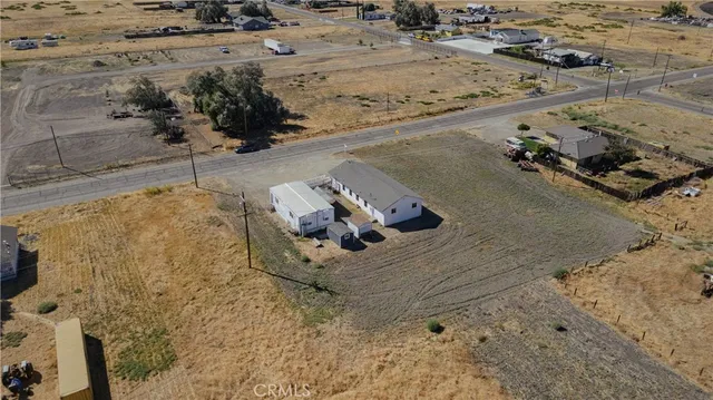 a bathroom with a sink mirror and shower