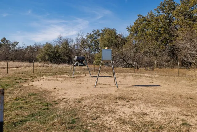 a view of a yard with a tree