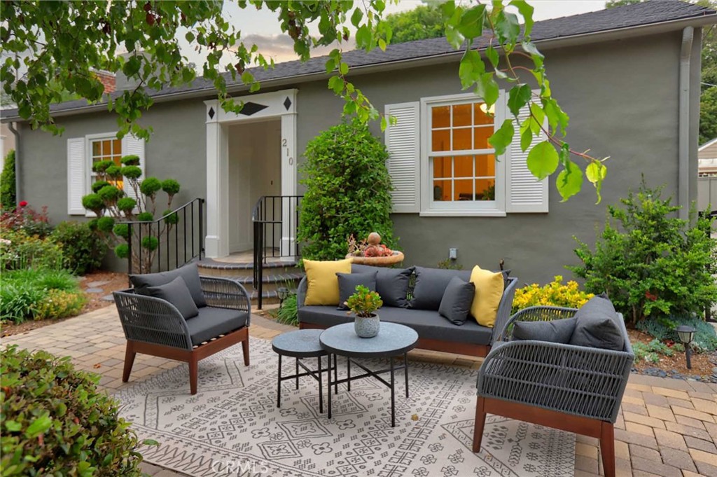210 Sierra View Road Pasadena, CA 91105 - Photo 11 of 65 a backyard of a house with table and chairs