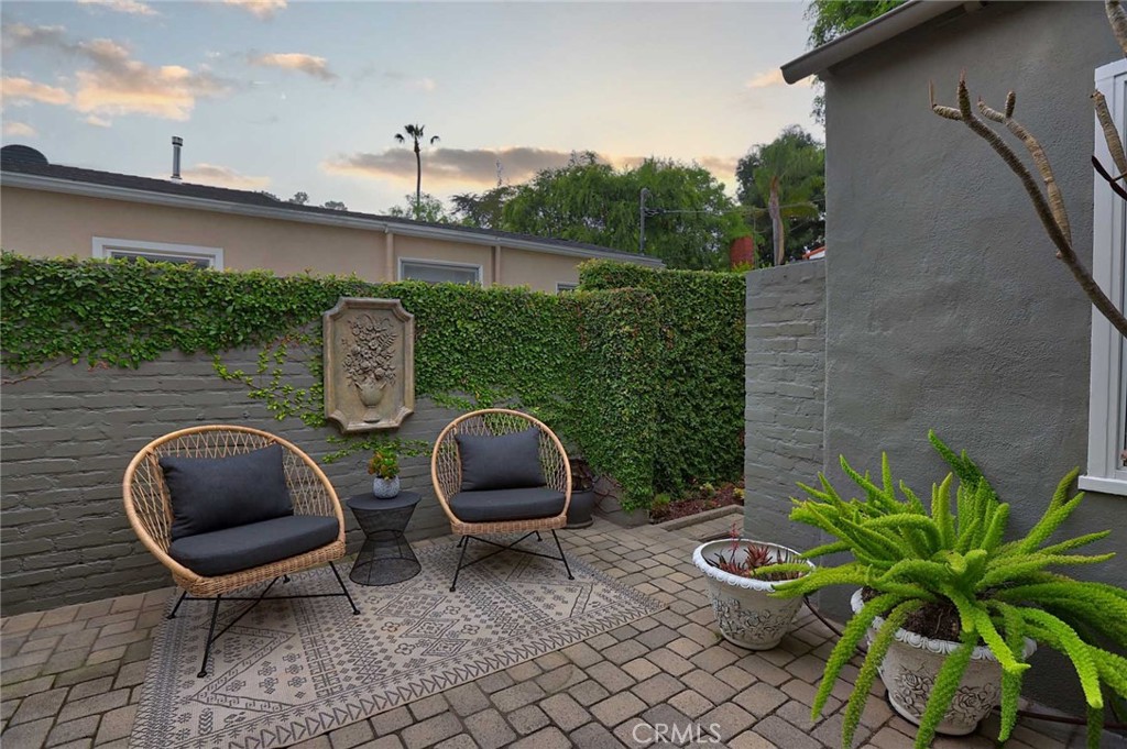 210 Sierra View Road Pasadena, CA 91105 - Photo 34 of 65 a backyard of a house with wooden floor and outdoor seating