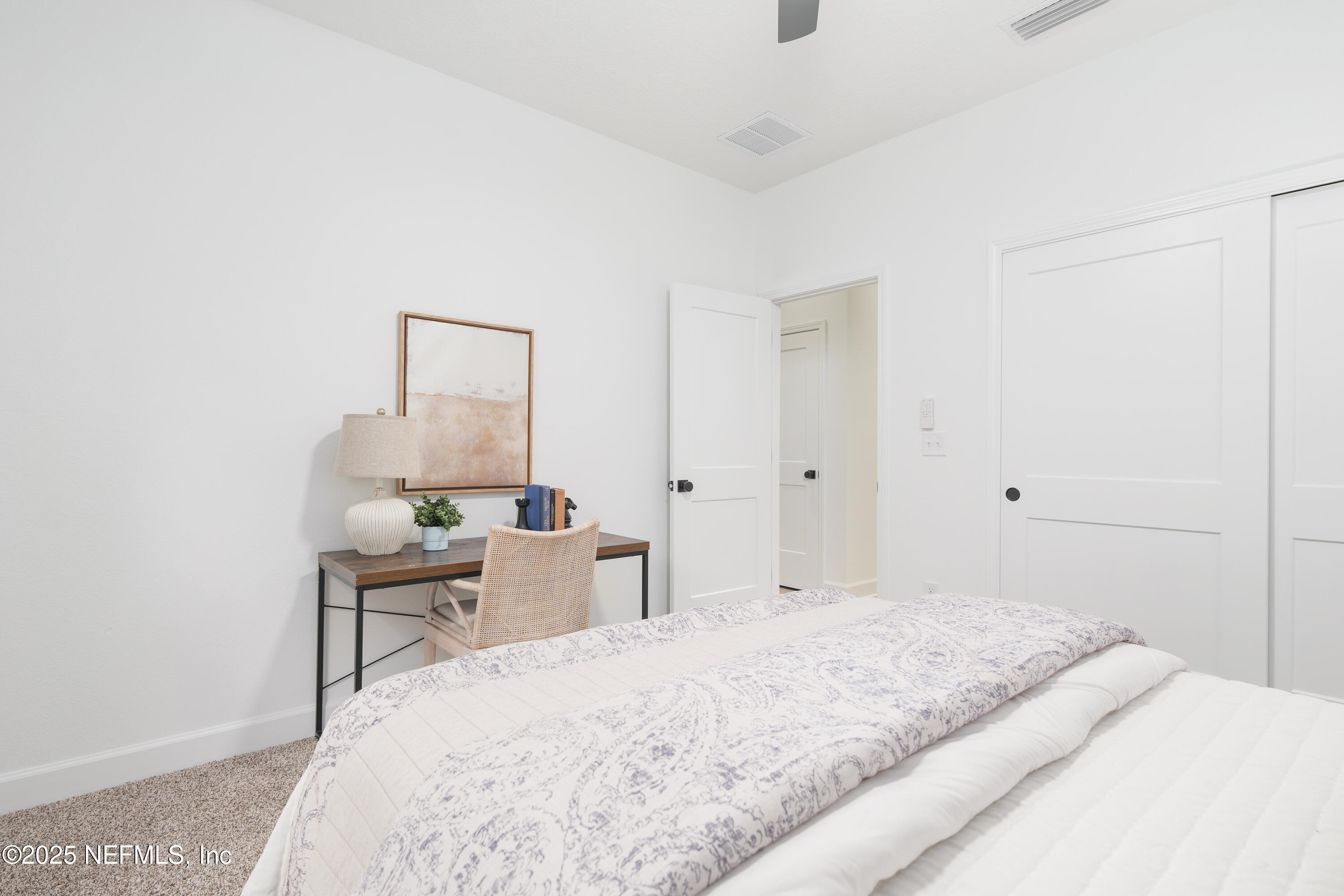 5729 Chippewa Avenue Keystone Heights, FL 32656 - Photo 17 of 20 a bedroom with a bed and a table