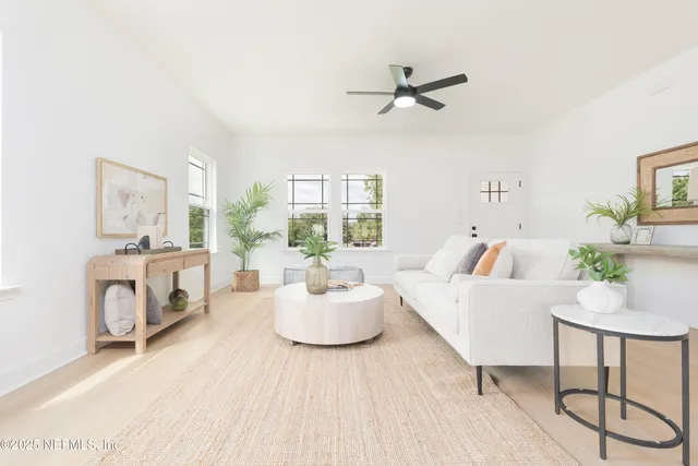 a living room with furniture and a fireplace