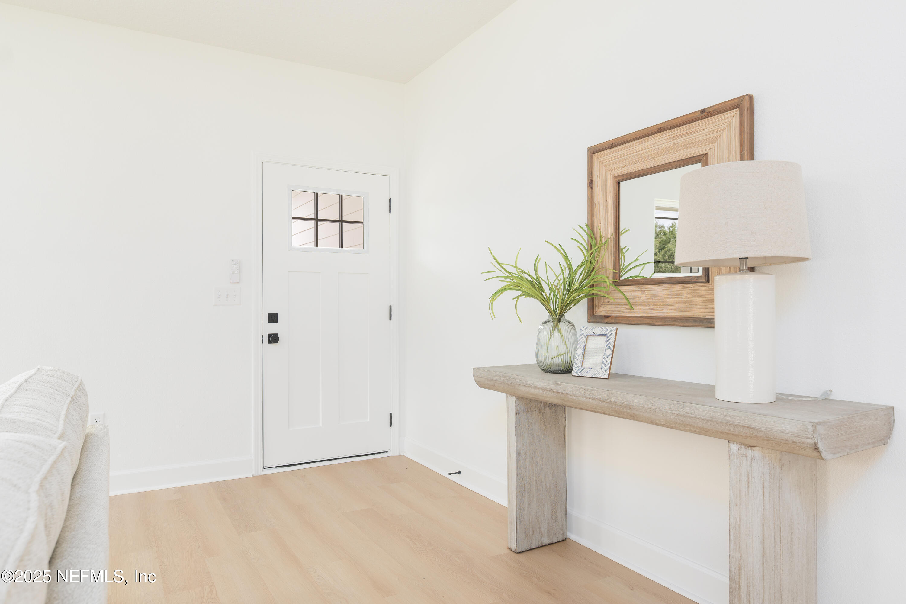 5729 Chippewa Avenue Keystone Heights, FL 32656 - Photo 10 of 20 a bathroom with a sink a mirror and a potted plant