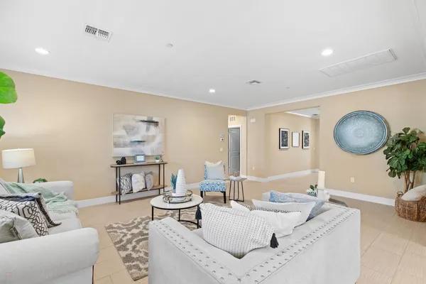 a kitchen with stainless steel appliances kitchen island granite countertop a sink a stove a refrigerator and island with wooden floor