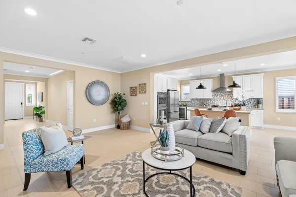 a kitchen with sink refrigerator and microwave