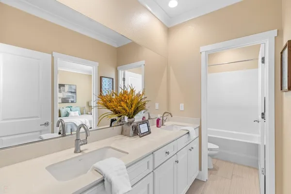 a bedroom with a bed and a table