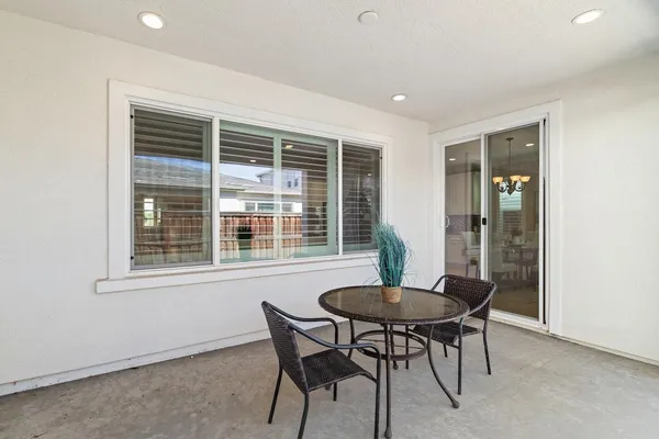swimming pool with an outdoor seating yard and mountain view in back