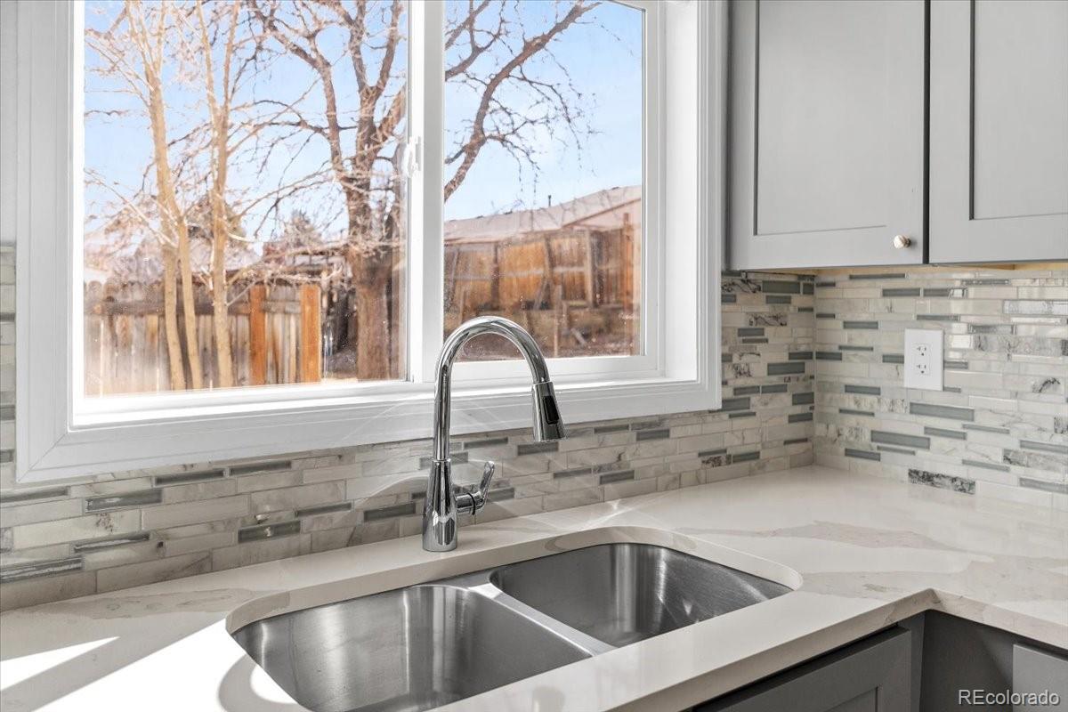 16222 East Rice Place, Unit B Aurora, CO 80015 - Photo 11 of 31 a kitchen with a sink and a window