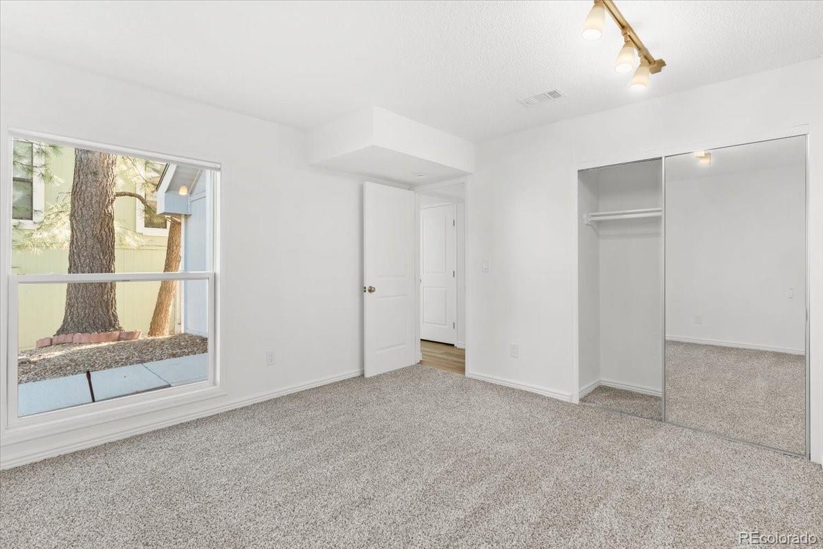16222 East Rice Place, Unit B Aurora, CO 80015 - Photo 16 of 31 a view of an empty room with a window