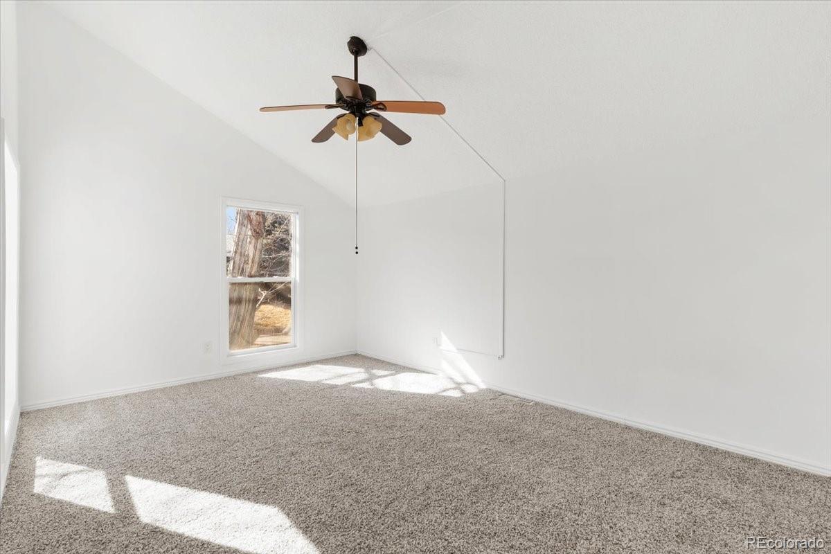16222 East Rice Place, Unit B Aurora, CO 80015 - Photo 19 of 31 a view of room with a ceiling fan and window