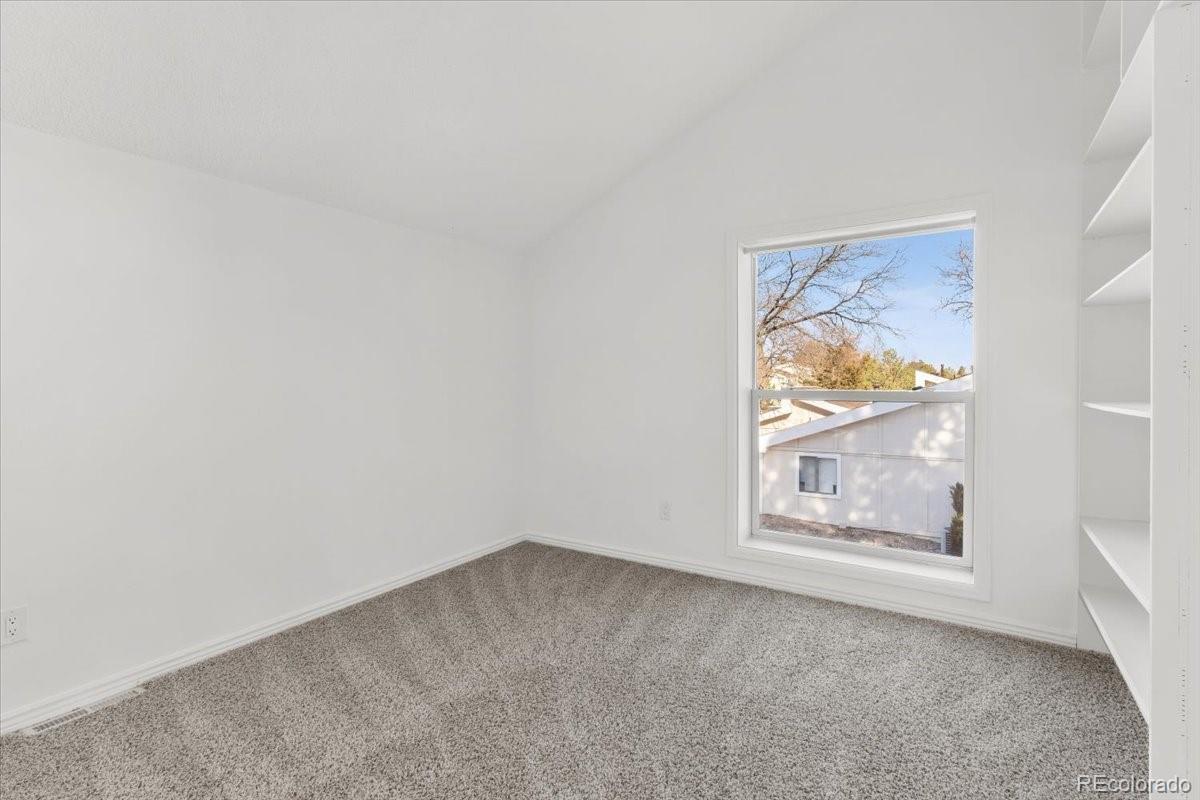 16222 East Rice Place, Unit B Aurora, CO 80015 - Photo 23 of 31 an empty room with a window