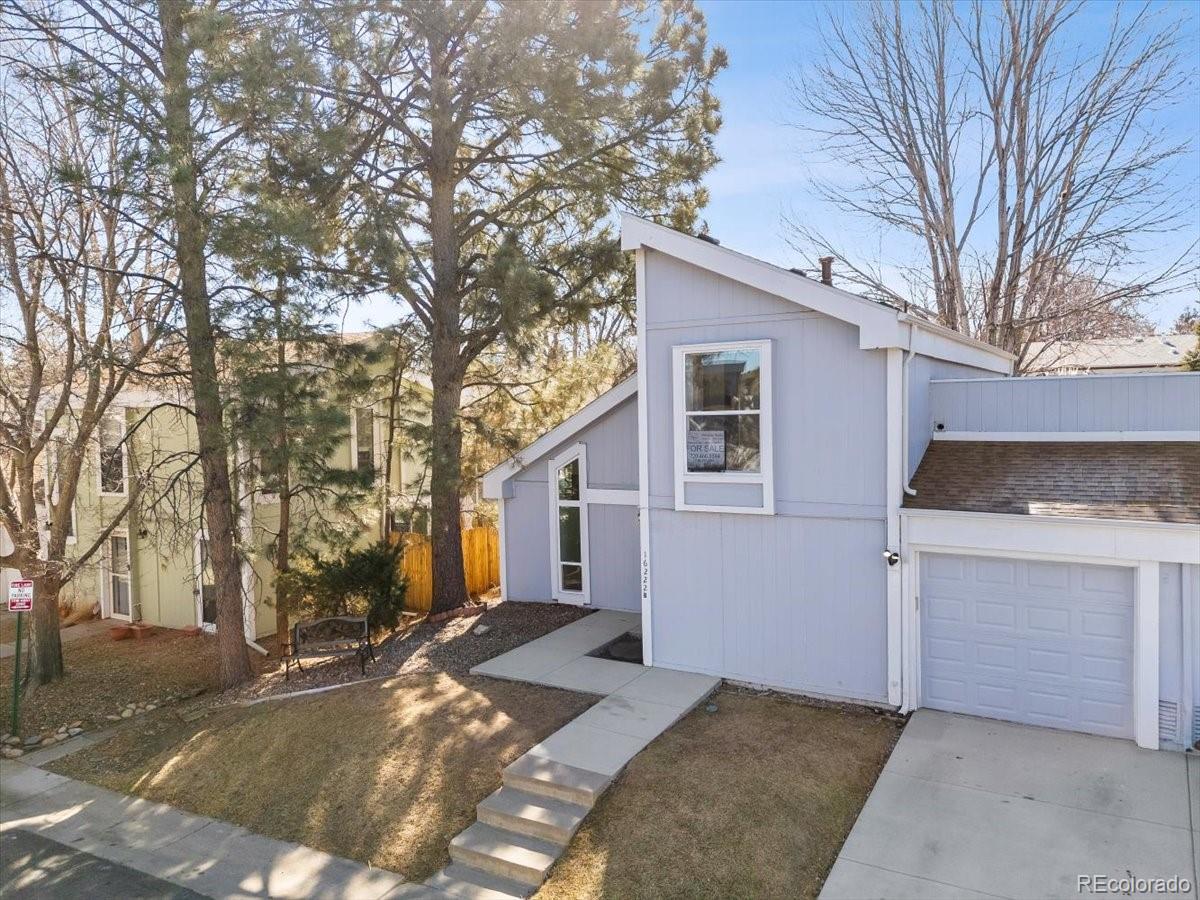 16222 East Rice Place, Unit B Aurora, CO 80015 - Photo 3 of 31 a view of a house with a yard