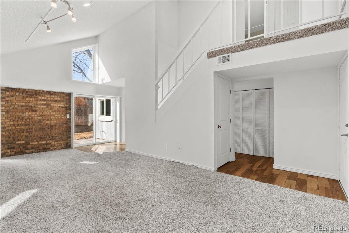 16222 East Rice Place, Unit B Aurora, CO 80015 - Photo 5 of 31 a view of an empty room with a window